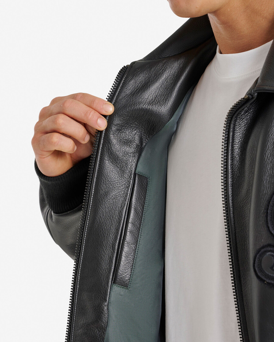 chaqueta universitaria roots signature