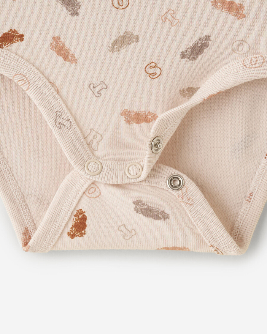 primer body para bebé roots