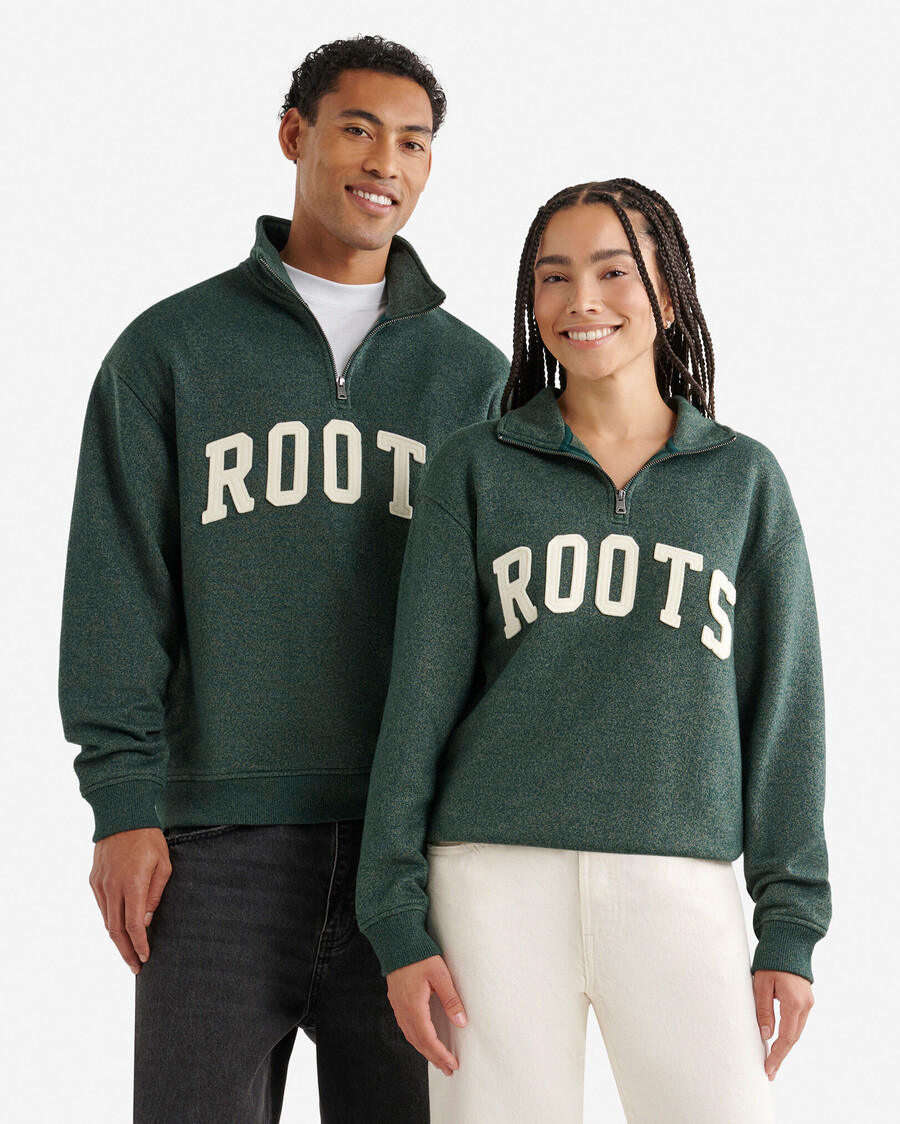 jarra de media cremallera con apliques roots