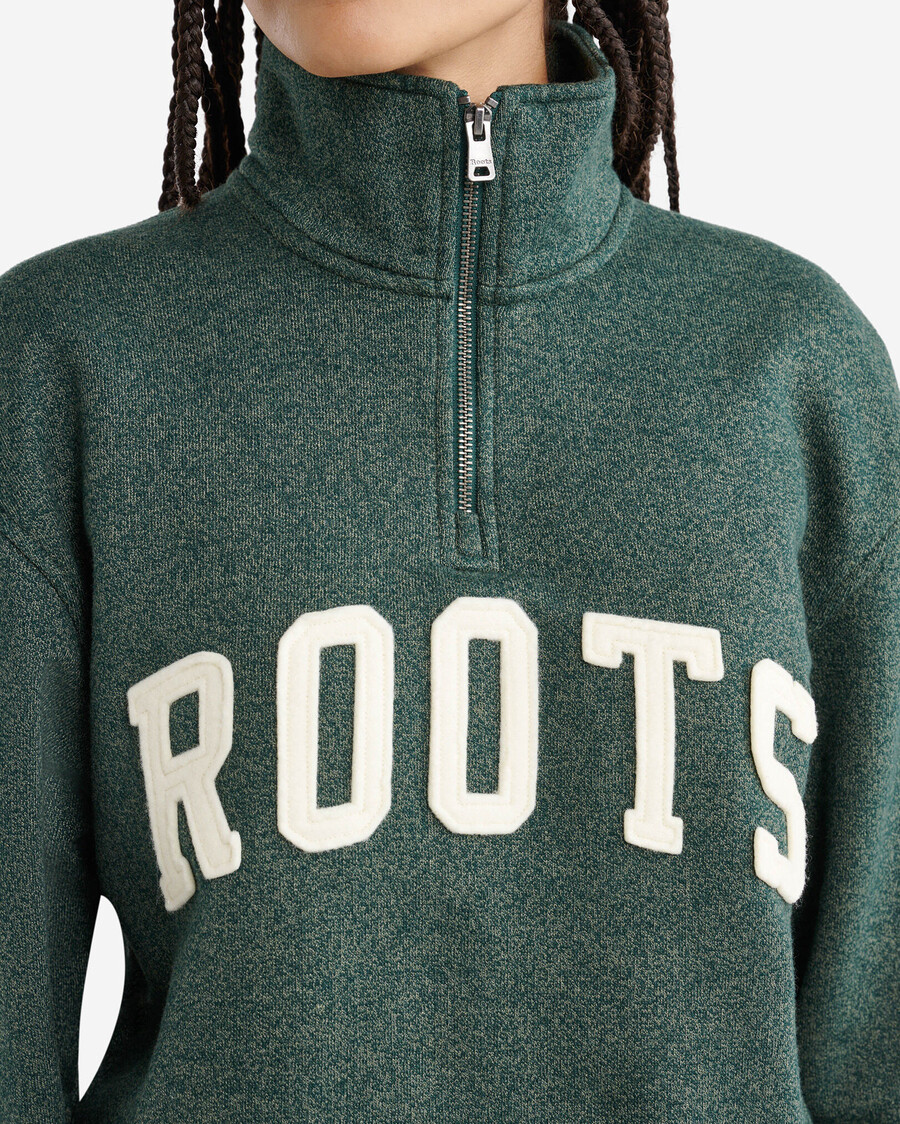 jarra de media cremallera con apliques roots